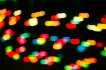 colorful bokeh lights against black 