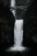 bridge over a waterfall 