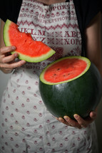 a woman holding a watermelon