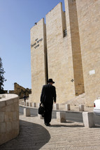 a man walking towards a synagogue 