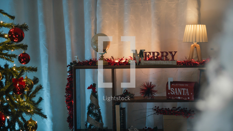 Christmas home decorations with blurred Santa Claus