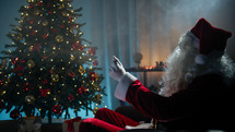 Santa Claus lights up the Christmas tree