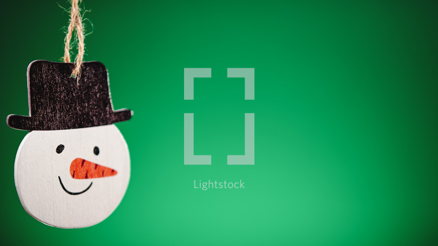 Christmas snowman decoration with green background