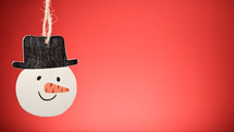Christmas snowman decoration with red background