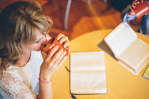 woman reading a Bible at a Bible study 
