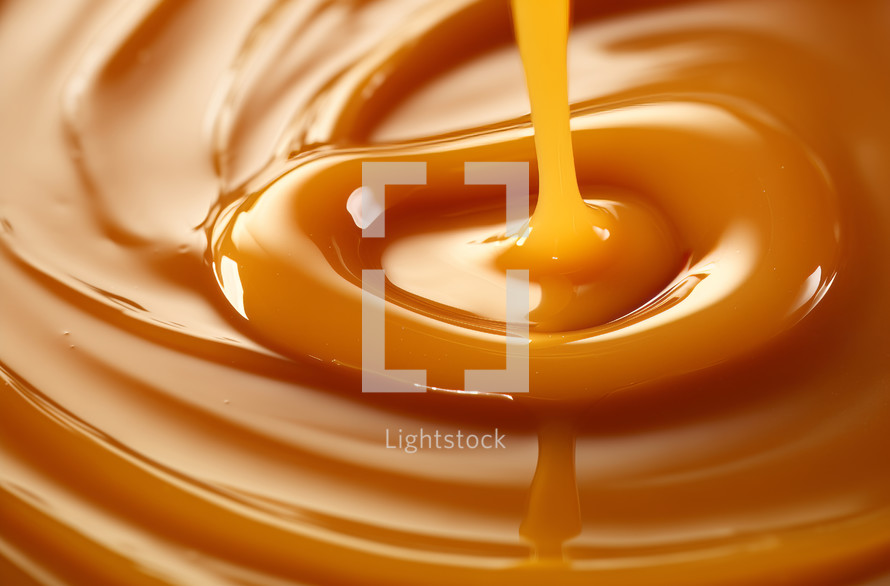 Close-up view of flowing liquid caramel texture
