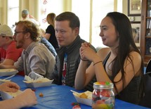 young adults eating at a luncheon 