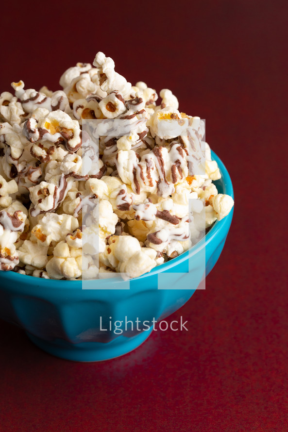 pile of White and Milk Chocolate Drizzled Sweet Popcorn