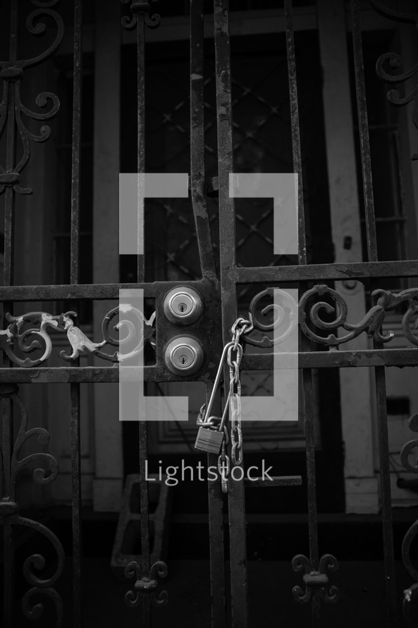 lock and chains on a metal gate 