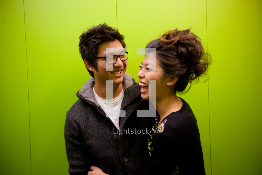 laughing Asian couple 