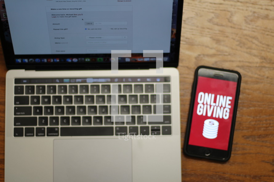 online giving app on a cellphone on a laptop computer 