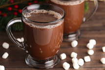Mug of Hot Chocolate Isolated on a Wood Background