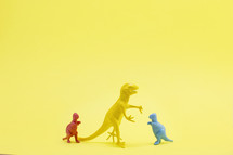 dinosaur figurine on yellow background 
