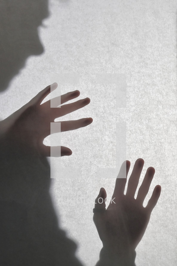 Shadowy Human Figure Behind A Matte glass