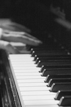 hands playing a keyboard 