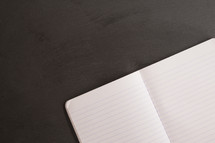 open notebook on a slate background 