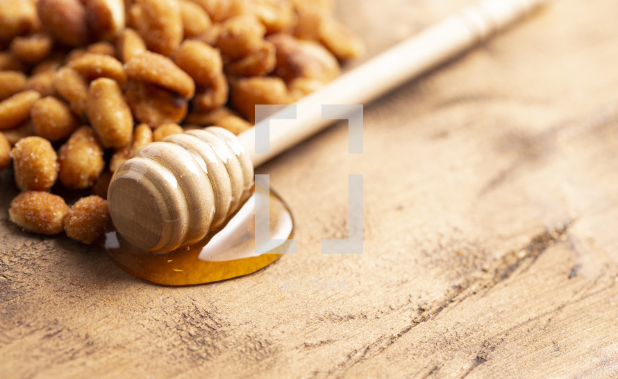 Honey Roasted Peanuts on a Dark Wooden Table