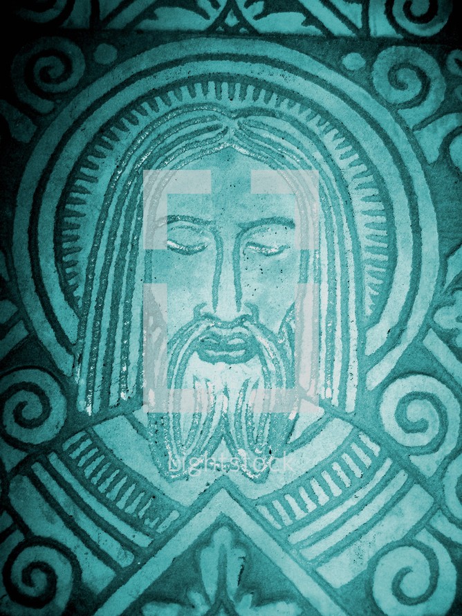 Stone etching of the face of Jesus Christ created in the style of early Aztec art.