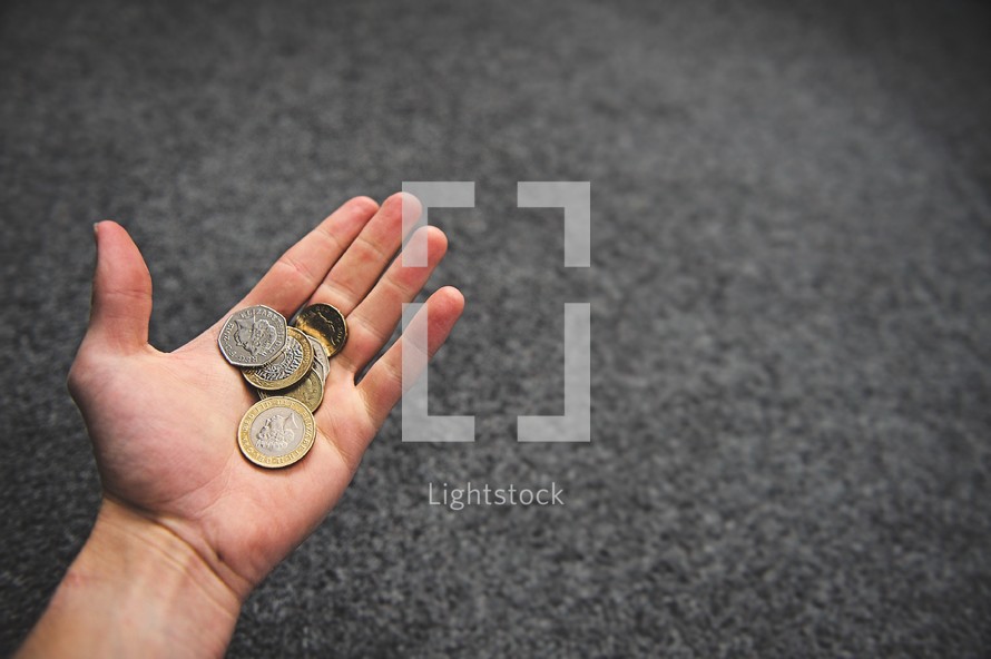 coins in a hand 