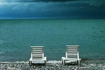 lounge chairs on a beach 