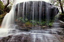 Veil waterfall off a boulder.