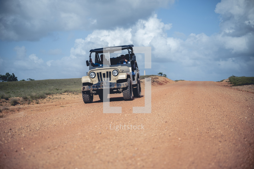 a Jeep on a dirt road in Honduras 
