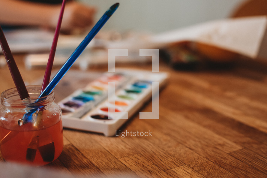 watercolor paints on a table 
