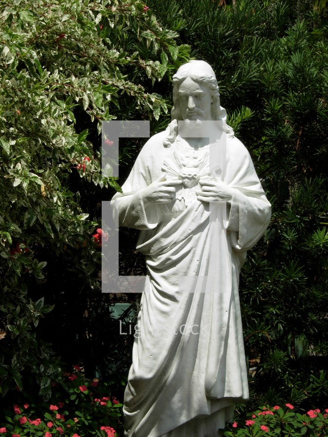 statue of Jesus in a garden 