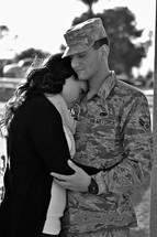 a couple hugging before a soldiers deployment 