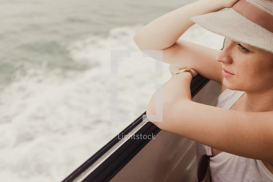 a woman looking off a ferry 