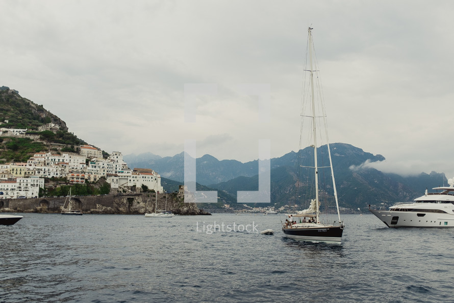 sailboat and yacht in the waters of Italy