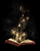glowing dust from the pages of a Bible 