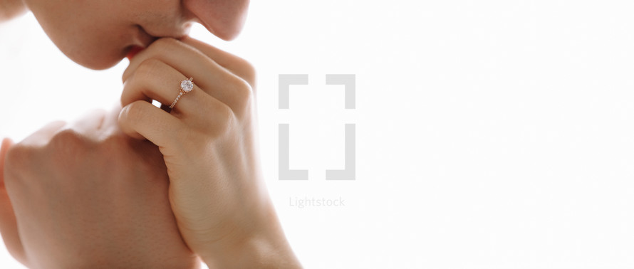 She told him yes. Close-up of a young man kissing his wife's hand with gold ring while making a marriage proposal. Engagement of a young couple in love. The concept of love and togetherness