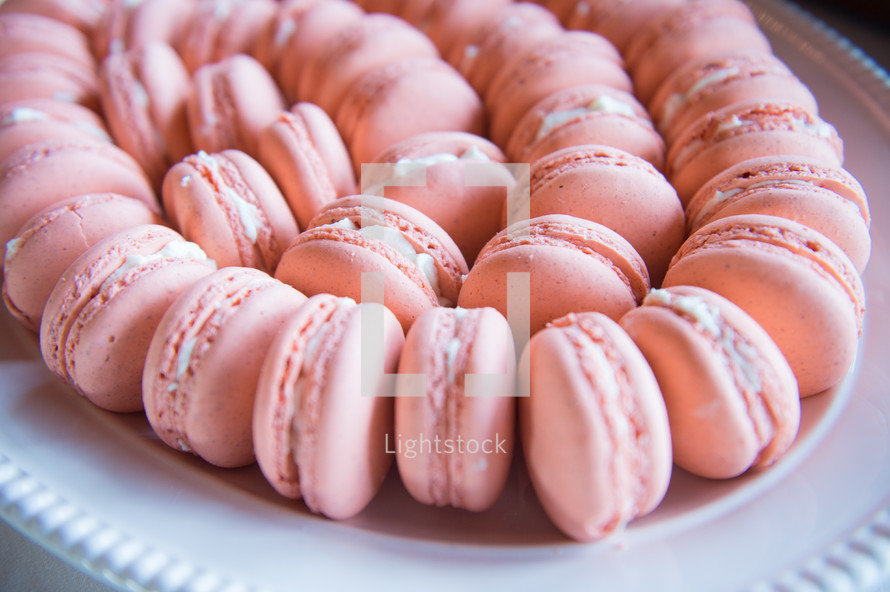 pink cookies on a tray 