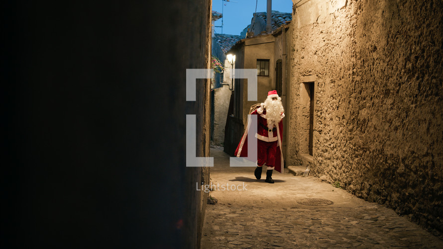 Santa Claus around the street on Christmas night