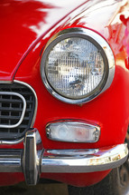 Headlight on red car