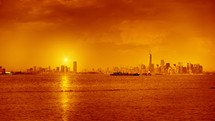 orange glow over New York City skyline at sunset 