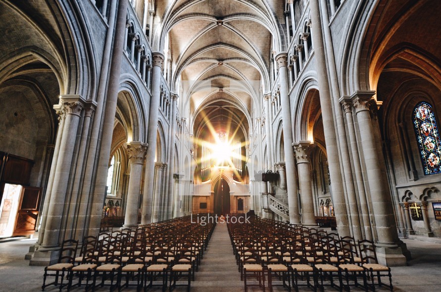 rows of chairs in a cathedral 