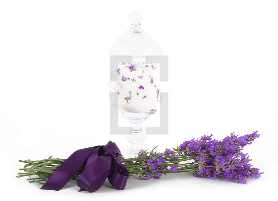 Lavender flower with bath salts on white background