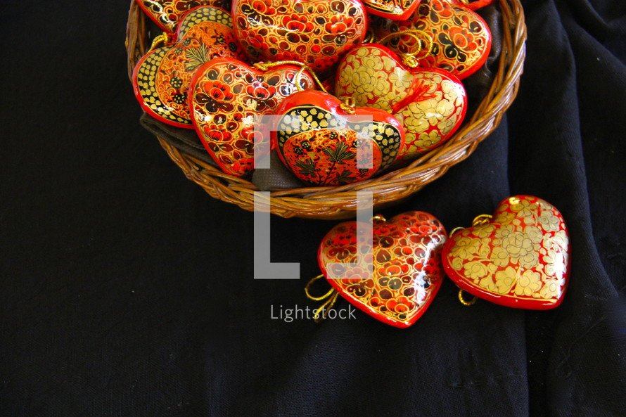 basket of heart shaped hand made wooden ornaments 