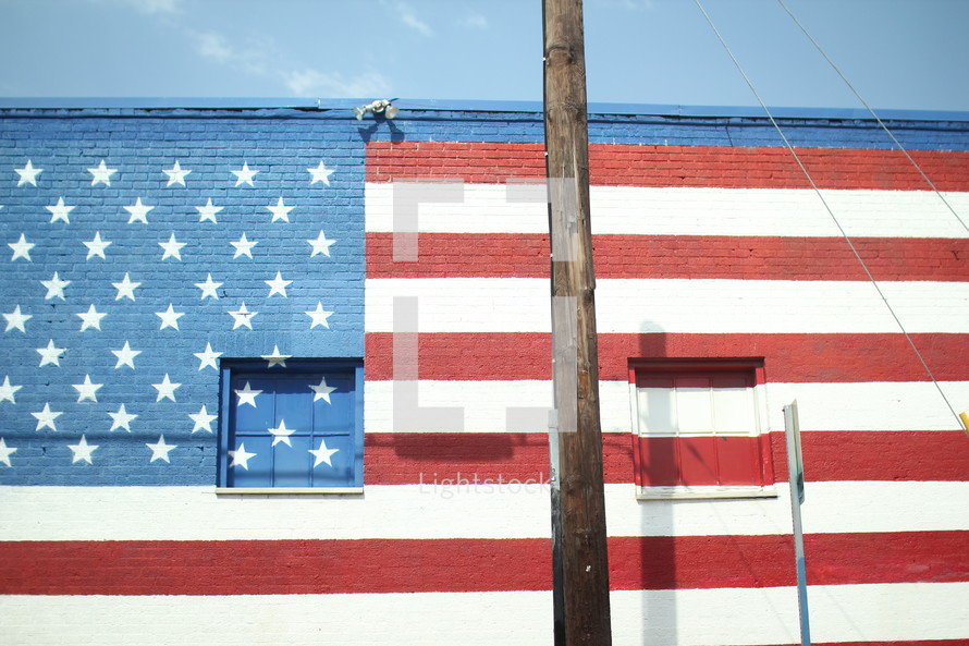 American flag painted on a brick wall 