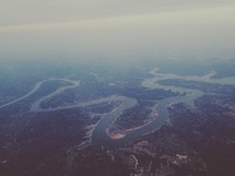 aerial view above a winding river 