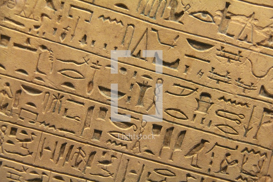 Egyptian hieroglyphics set in clay