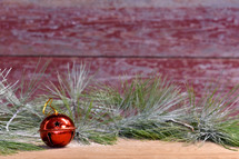 Christmas greenery and red bell 