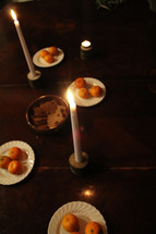 oranges on plates on a dinner table 