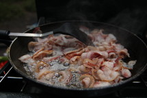 cooking bacon outdoors 