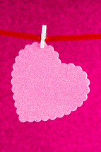 pink heart cutout on a clothesline 