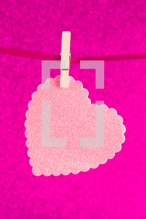 pink heart cutout on a clothesline 