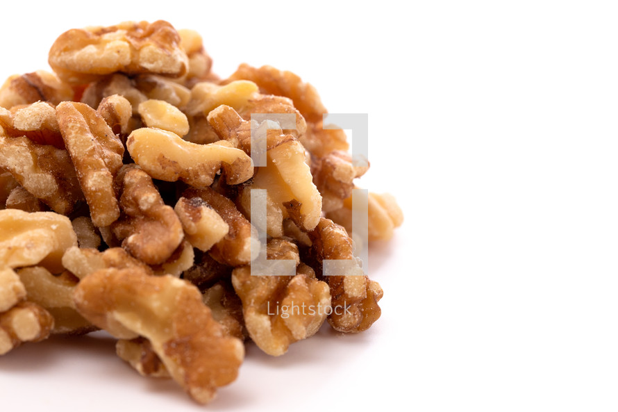 A Pile of Healthy Walnuts on a White Background
