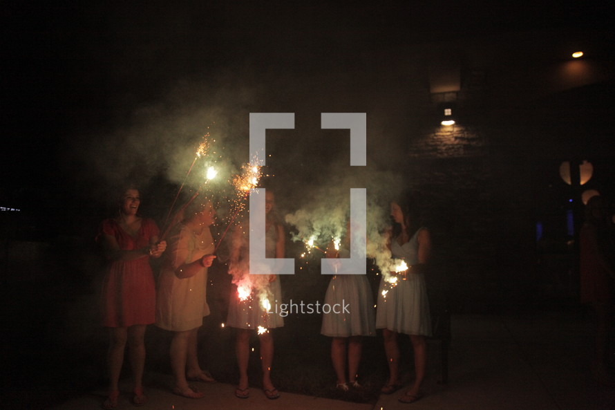 woman holding sparklers 